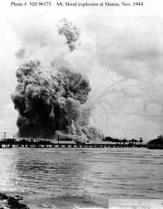 Photo #: NH 96173 USS Mount Hood (AE-11) Smoke cloud expanding, just after she exploded in Seeadler Harbor,  Manus, Admiralty Islands, 10 November 1944. Photographed by a  photographer of the 57th Construction Battalion, who had set up his  camera to take pictures of the Battalion's camp. Collection of Commander Lester B. Marx. U.S. Naval Historical Center Photograph.